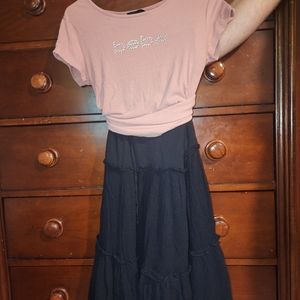 Pink shirt and black skirt.